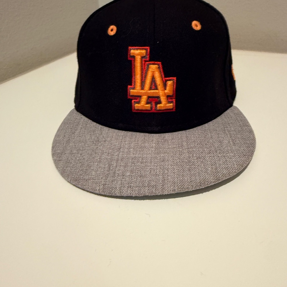 New Era Youth 9FIFTY Snapback Hat in Black with Orange Eyelets